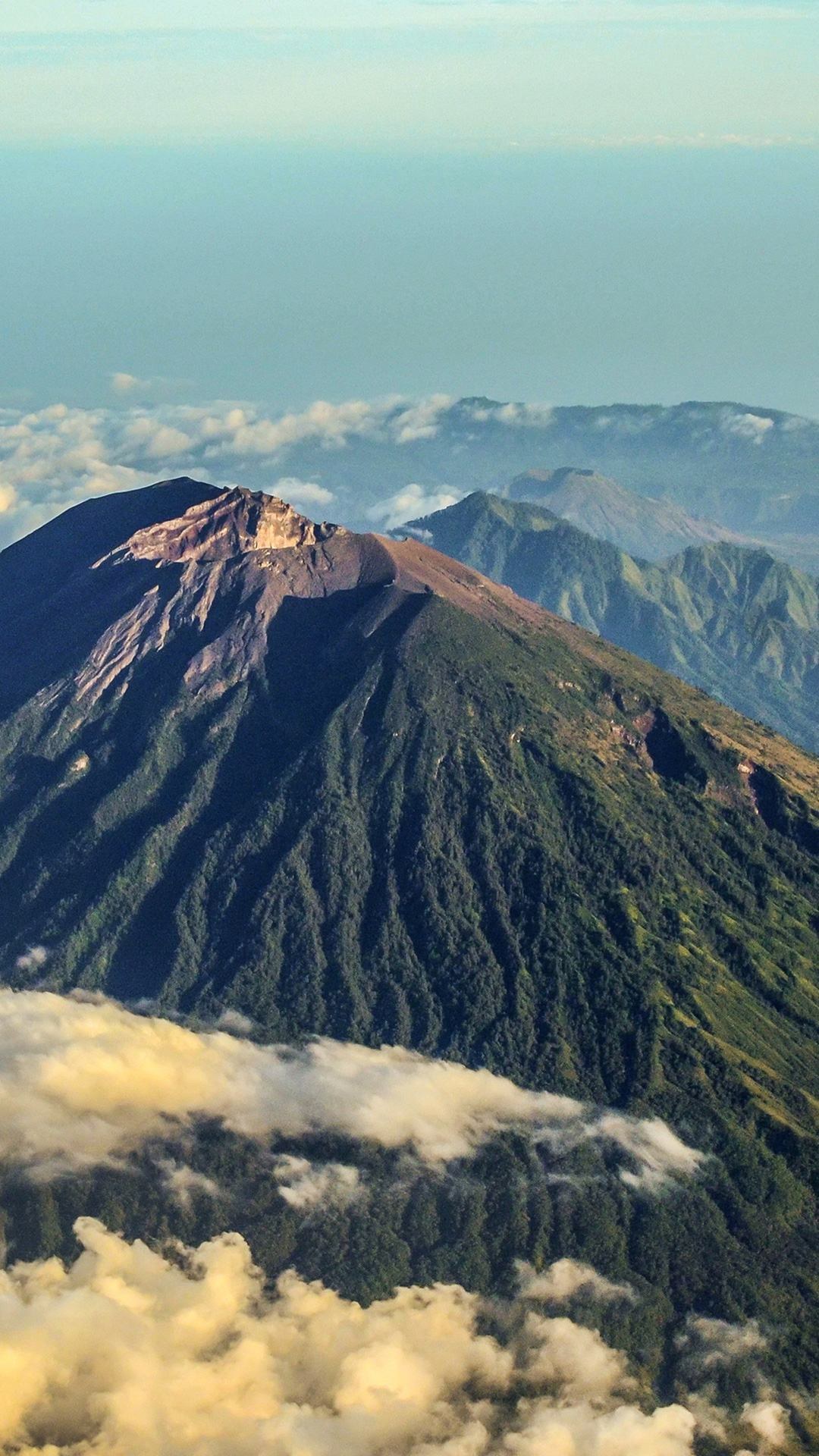 The ridge and crater rim of Mount Agung above the cloud line